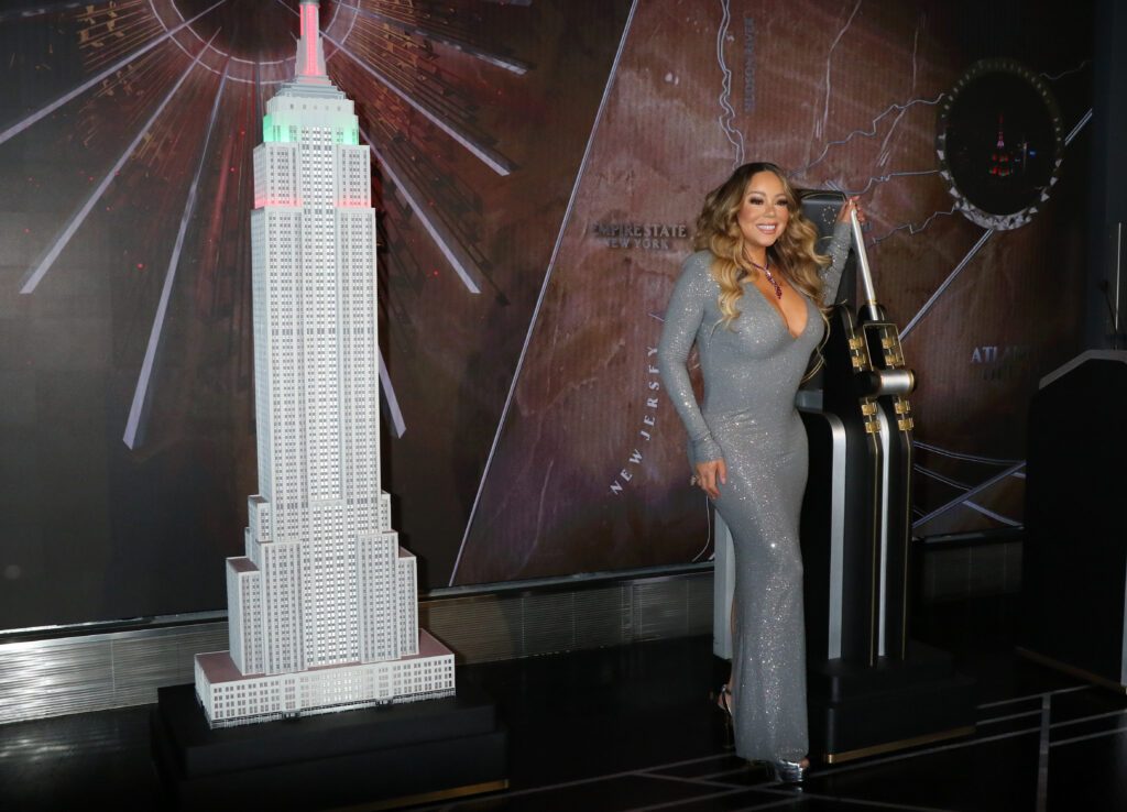 NEW YORK NEW YORK DECEMBER 17 Mariah Carey lights the Empire State Building in celebration of the 25th anniversary Pubity