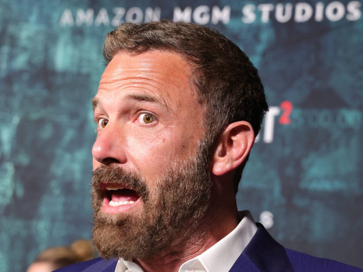 Ben Affleck answering a question on the red carpet of the premiere for The Accountant 2.